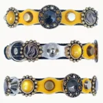 Overzicht van alle zijden van de handgemaakte “Boldfire Crest” kattenhalsband met gele en zilverkleurige patches, luxe steentjes, dubbele metalen studs, zachte binnenlaag en veilige elastische sluiting.