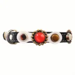 Luxury white‑leather feline collar with red coral stones, brass accents, elastic safety clasp and comfortable inner layer.