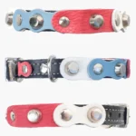 All-sides view of the black leather “Dutch Breeze” cat collar featuring red, white and light-blue leather details, shiny silver studs and a fresh, expressive Dutch-inspired design.