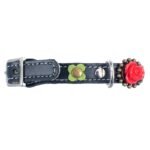 Left-side view of a black leather gothic cat collar featuring red 3D roses, showing the safety closure with buckle and elastic, designed for anti-entanglement protection and a quick release breakaway safety function. The angle highlights the romantic gothic styling and floral details of the design.