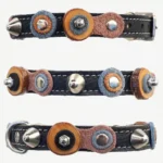 Vintage kattenhalsband van jeans‑blauw en bruin leer met olijfhouten schijfjes, zilveren studs en een zachte binnenlaag.