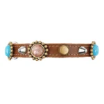 A black leather cat collar with turquoise luxury stones in the elegant “Bohemian Jewel” design, shown from the front in a slightly elevated angle on a white background.