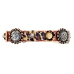 Right‑side angle of the “Camouflage Luxe” cat collar showing the leopard‑print leather, spikes, and smooth inner layer for feline comfort.