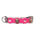 Small black leather dog collar with a vivid fuchsia top layer, flat silver studs and rounded brass spikes from the “Glam Diva” design. A bold, glamorous look for small dogs like Chihuahuas, Pomeranians and the less‑common Papillon, whose expressive style suits the diva colour.