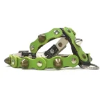 Black leather dog harness with a deep forest‑green top layer, decorated with alternating rounded studs and sharp metal spikes, shown from the left side. The strong materials, polished hardware and earthy green tone create a bold, confident look inspired by natural strength.