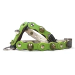 Black leather dog harness featuring a rich forest‑green overlay with mixed metal studs and spikes, shown from the right side. The contrast between the black base and natural green colour gives the harness a powerful, grounded aesthetic with a rebellious edge.