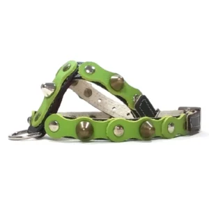Black leather dog harness featuring a rich forest‑green overlay with mixed metal studs and spikes, shown from the right side. The contrast between the black base and natural green colour gives the harness a powerful, grounded aesthetic with a rebellious edge.