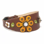 Right‑side view of the artisanal “Sunflower Dream” greyhound collar in brown leather, showing the bold yellow sunflower with clean stitching and a bright, cheerful look. The tapered silhouette fits an Italian Greyhound, and offers the same warm, expressive charm to Cocker Spaniels and Shiba Inus.