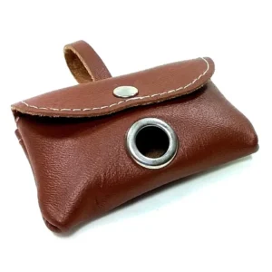 Brown leather dog poop bag holder with stitching and metal grommet, shown from the front with bag ready to pull.